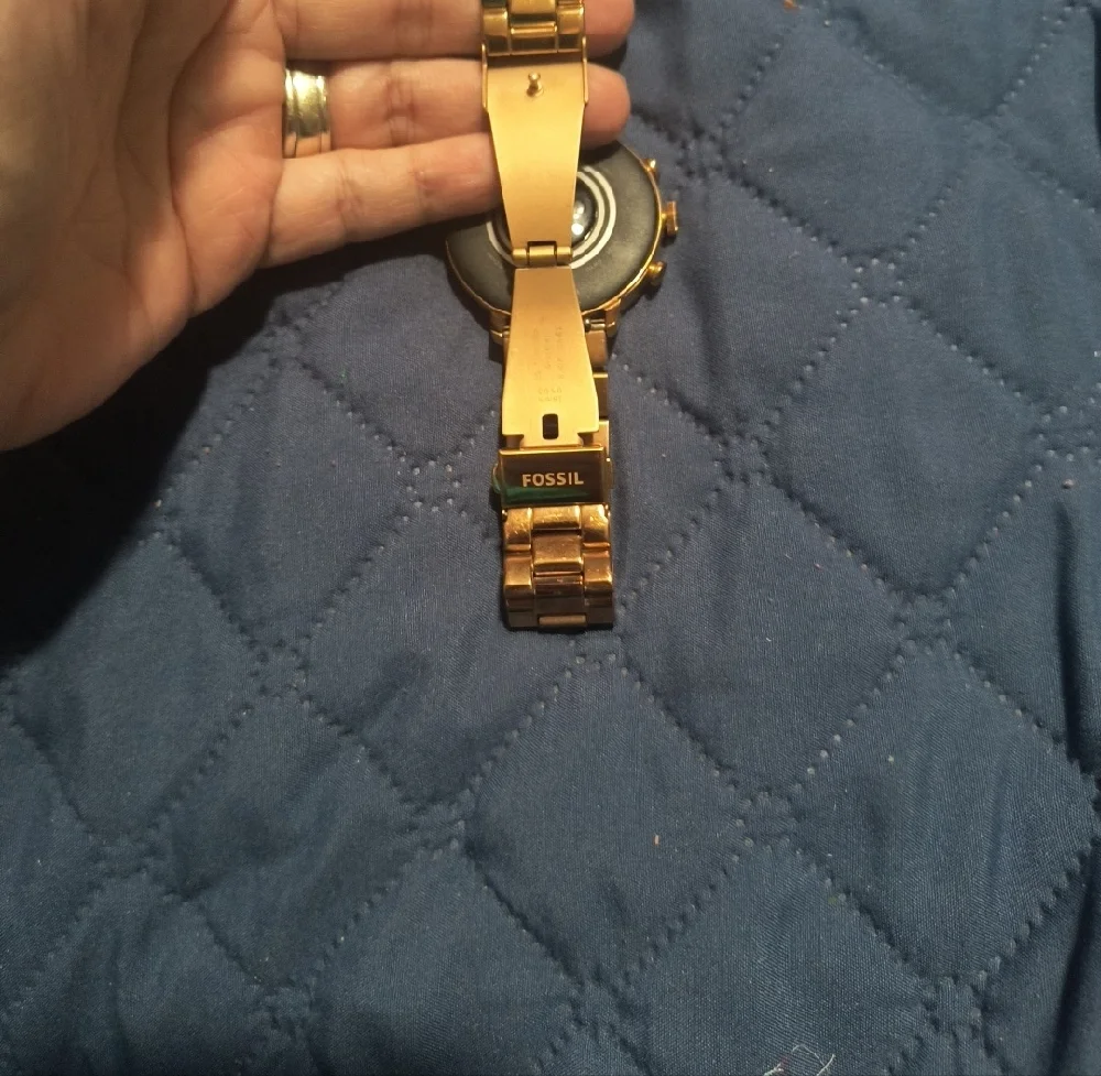 Gold Smartwatch with Black Charging Cable